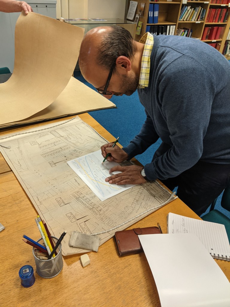 Workshop participant researching local history through maps